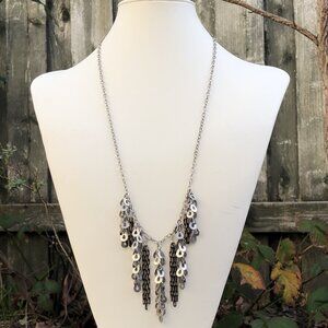 Long necklace with silver paillettes and black/gold chains